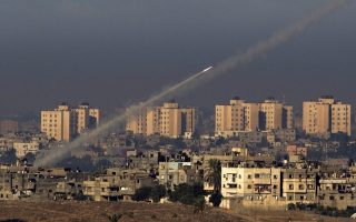 Palestinian militants fire a rocket from the northern Gaza Strip toward southern Israel on Thursday. For the past decade, Palestinians in Gaza have been shooting short-range rockets into southern Israel. But Palestinians fired a much longer range rocket that landed just outside Jerusalem on Friday, a move seen as a major escalation.