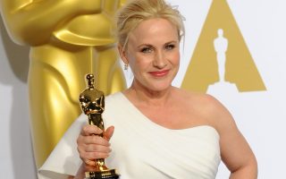 Patricia Arquette had to put down her celebratory glass of champagne before she posed with her Oscar at the 87th Academy Awards in Hollywood, Los Angeles. Wearing a custom Rosetta Getty gown and Fred Leighton jewels, she won the Oscar for Best Actress in a Supporting Role for 'Boyhood'. She was pictured in the Oscar press room at the Loews Hollywood Hotel.<P><noscript><img width= 
