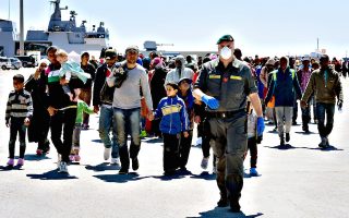 Rescued migrants walk along the quayside...Rescued migrants walk along the quayside after disembarking from the Italian Navy vessel Bettica in the Sicilian harbour of Augusta on April 22, 2015 . European governments came under increasing pressure to tackle the Mediterranean's migrant crisis ahead of an emergency summit, as harrowing details emerged of the fate of hundreds who died in the latest tragedy.    AFP PHOTO / ALBERTO PIZZOLIALBERTO PIZZOLI/AFP/Getty Images