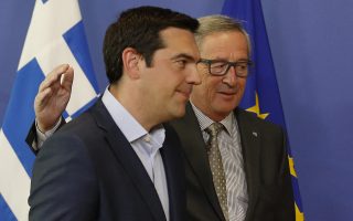 epaselect epa04782012 European Commission President Jean-Claude Juncker (R) welcomes Greek Prime Minister Alexis Tsipras (L) prior to a meeting at the EU commission headquarters in Brussels, Belgium, 03 June 2015. Greek Prime Minister Alexis Tsipras meets European Commission President Jean-Claude Juncker in Brussels amid intense media speculation in Athens that a breakthrough is imminent in the country's bailout saga. The head of the Eurogroup of finance ministers, Jeroen Dijsselbloem is also set to join the meeting, underlining hopes that a compromise deal between Athens and its international creditors is taking shape.  EPA/JULIEN WARNAND