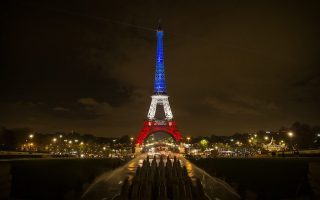 epaselect epa05028805 The Eiffel Tower is illuminated in the colors of the French flag in tribute for the victims of the 13 November terror attacks, in Paris, France, 16 November 2015. At least 132 people were killed and some 350 injured in the terror attacks on 13 November, which targeted a concert venue, a sports stadium, and several restaurants and bars in Paris. Authorities believe that three coordinated teams of terrorists armed with rifles and explosive vests carried out the attacks, which the Islamic State (IS) extremist group has claimed responsibility for.  EPA/ETIENNE LAURENT