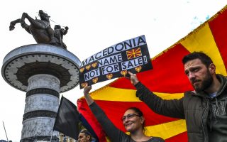 epa06579010 Macedonian citizens hold a banner and shout slogans protesting against the change of the constitutional name Republic of Macedonia at the main square in Skopje, The Former Yugoslav Republic of Macedonia, 04 March 2018. Demonstrators at an All-Macedonian protest for defending the name of the state and the identity of the nation in Skopje, demand the end of talks with Greece concerning the name-change and rejecting Albanian as official language throughout Macedonia and abolishing settlement with Bulgaria.  EPA/GEORGI LICOVSKI