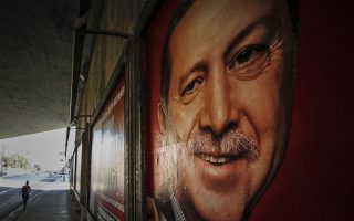 A poster of Turkey's President Recep Tayyip Erdogan, is seen on an underpass in Istanbul, Friday, June 15, 2018. Turkey holds parliamentary and presidential elections on June 24, 2018, seen as important as it will transform Turkey's governing system to an executive presidency.(AP Photo/Emrah Gurel)
