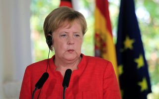 epa06943407 German Chancellor Angela Merkel attends a joint press conference with Spanish Prime Minister Pedro Sanchez, after their lunch meeting at Guzmanes Palace in Sanlucar de Barrameda, Spain, 11 August 2018. Chancellor Merkel is in Spain on a two-day visit for talks with Prime Minister Sanchez.  EPA/A. CARRASCO RAGEL