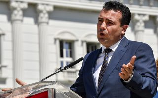 epa06772679 Macedonian Prime Minister Zoran Zaev addresses journalists during the press conference to mark the first year of his government's work in front of the Government building in Skopje, The Former Yugoslav Republic of Macedonia, 30 May 2018. Zaev said that he expect a telephone conversation with Greek Prime Minister Alexis Tsipras  'tonight, tomorrow or Friday', to make a step forward with negotiations for the name issues  in the next few days.  EPA/GEORGI LICOVSKI