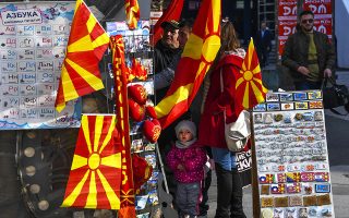 epa06500532 People look for souvenirs at a stall at the main square of the capital Skopje, The Former Yugoslav Republic of Macedonia, 06 February 2018. Prior to the resolution of the negotiations with Athens (Greece) on the name dispute, the public in Macedonia is eagerly awaiting the EU's strategy for the future of the Western Balkans.  EPA/GEORGI LICOVSKI