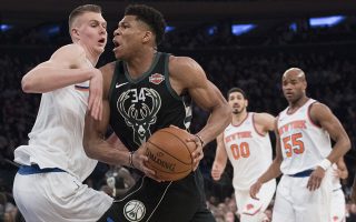 Milwaukee Bucks forward Giannis Antetokounmpo (34) drives to the basket against New York Knicks forward Kristaps Porzingis, left, during the first half of an NBA basketball game Tuesday, Feb. 6, 2018, at Madison Square Garden in New York. (AP Photo/Mary Altaffer)