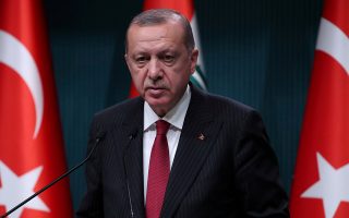 FILE PHOTO: Turkish President Tayyip Erdogan attends a news conference in Ankara, Turkey, August 14, 2018. REUTERS/Umit Bektas/File Photo