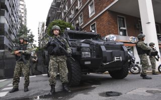 epa07198762 Members of Argentina's National Gendarmerie stand next to an armored vehicle near the G20 summit venue in Buenos Aires, Argentina, 29 November 2018 (issued 30 November 2018). The leaders of the world's largest economies arrived in Buenos Aires on Thursday for the first G20 summit to be held in South America.  EPA/LUKAS COCH  AUSTRALIA AND NEW ZEALAND OUT