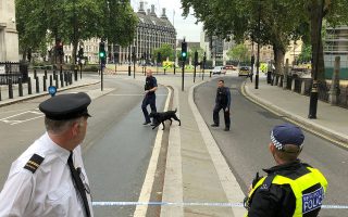 A police dog team works behind the cordon around Parliament Square after a car crashed outside the Houses of Parliament in Westminster, London, Britain, August 14, 2018. REUTERS/Andrew Marshall
