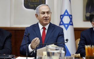 Israeli Prime Minister Benjamin Netanyahu chairs the weekly cabinet meeting at his office in Jerusalem, Sunday, July 8, 2018. (Abir Sultan/PoolPhoto via AP)