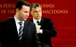 FILE PHOTO: Macedonian Prime Minister Nikola Gruevski (L) stands in front of his Hungarian counterpart Viktor Orban during news conference in Skopje May 12, 2011. Prime Minister Orban is on a one-day official visit to Macedonia.    REUTERS/Ognen Teofilovski/File Photo