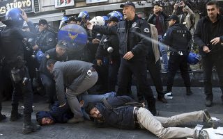 Police officers detain supporters of pro-Kurdish Peoples' Democratic Party, HDP, as they protest the detentions of Kurdish lawmakers, in Ankara, Turkey, Friday, Nov. 4, 2016. Authorities in Turkey detained 11 pro-Kurdish lawmakers early Friday as part of ongoing terror-related investigations, including both party co-chairs Selahattin Demirtas and Figen Yuksekdag and other senior officials, the Interior Ministry said. (AP Photo)
