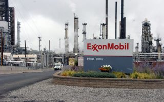 FILE - This Wednesday, Sept. 21, 2016, file photo shows Exxon Mobil's Billings Refinery in Billings, Mont. President-elect Donald Trump this week tapped ExxonMobil CEO Rex Tillerson to serve as his secretary of state. If confirmed by the Senate, where opposition is emerging, the move could have broad consequences for U.S. environmental policy and affect the role the U.S. plays in multinational discussions about climate change. (AP Photo/Matthew Brown, File)