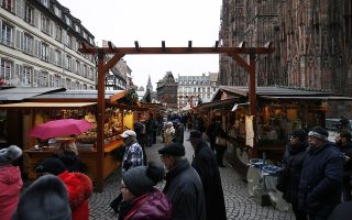 epa07230745 People visit the Christmas Market, in Strasbourg, France, 14 December 2018, where a terror attack took place. Cherif Chekatt, the perpetrator of the Christmas Market attack, has been killed, at a building rue de Lazaret, in the Neudorf district of Strasbourg, on 13 December 2018. Three people died following the shooting at the market and several more were seriously injured during the incident on 11 December 2018.  EPA/RONALD WITTEK