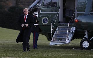 President Donald Trump exits the Marine One helicopter as he returns to the White House, Friday, Dec. 7, 2018, in Washington, after speaking at the 2018 Project Safe Neighborhoods National Conference. (AP Photo/Jacquelyn Martin)