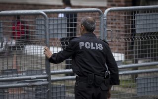 A Turkish police officer secures the entrance to Saudi Arabia's consulate in Istanbul, Sunday, Oct. 14, 2018. Veteran Saudi journalist Jamal Khashoggi disappeared over a week ago while on a visit to the Saudi Consulate in Istanbul, sparking an international uproar involving the kingdom, Turkey and the United States that remains unresolved. (AP Photo/Petros Giannakouris)