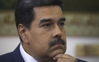Venezuela's President Nicolas Maduro listens during an interview with The Associated Press at Miraflores presidential palace in Caracas, Venezuela, Thursday, Feb. 14, 2019. Even while criticizing Donald Trump's confrontational stance toward his socialist government, Maduro said he holds out hope of meeting the U.S. president to resolve an impasse over his recognition of opponent Juan Guaido as Venezuela's rightful leader. (AP Photo/Ariana Cubillos)