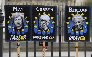 epa07482550 Posters mocking British politicians outside the Houses of Parliament in Westminster, central London, Britain, 03 April 2019. Reports state that British Prime Minister Theresa May is expected to meet Labour opposition leader Jeremy Corbyn later in the day looking for a way to to break the Brexit deadlock. May also is to ask the EU for an extension to the Brexit deadline.  EPA/FACUNDO ARRIZABALAGA