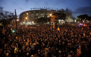Catalan pro-independence demonstrators gather outside the Camp Nou stadium ahead of a Spanish La Liga soccer match between Barcelona and Real Madrid in Barcelona, Spain, Wednesday, Dec. 18, 2019. Thousands of police and private security personnel were deployed Wednesday in and around Barcelona's Camp Nou stadium to ensure that a protest over Catalonia's separatist movement does not disrupt one of the world's most-watched soccer matches. (AP Photo/Joan Mateu)