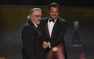 Leonardo DiCaprio, right, presents the lifetime achievement award to Robert De Niro at the 26th annual Screen Actors Guild Awards at the Shrine Auditorium & Expo Hall on Sunday, Jan. 19, 2020, in Los Angeles. (Photo/Chris Pizzello)