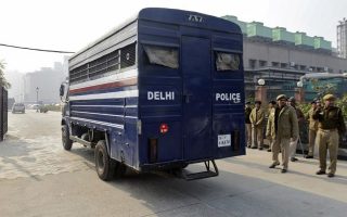 A police van carrying five men accused of the gang rape and murder of an Indian student arrives at a court in New Delhi January 7, 2013. Five men accused of the gang rape and murder of an Indian student appeared in court on Monday to hear charges against them, after two of them offered evidence possibly in return for a lighter sentence in the case that has led to a global outcry. The five men, along with a teenager, are accused of raping the 23-year-old physiotherapy student on a bus in New Delhi. She died two weeks later on December 28 in a Singapore hospital. REUTERS/Stringer (INDIA - Tags: CRIME LAW CIVIL UNREST POLITICS TPX IMAGES OF THE DAY) - RTR3C6AG