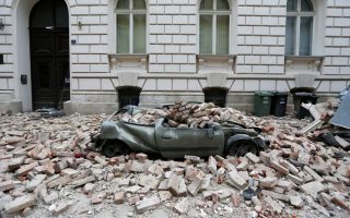 A destroyed car is seen following an earthquake, in Zagreb, Croatia March 22, 2020. REUTERS/Antonio Bronic