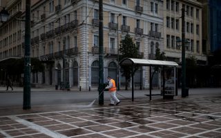 A municipal worker wearing a protective suit disinfects Klafthmonos square, after the Greek government imposed a nationwide lockdown to contain the spread of the coronavirus disease (COVID-19), in Athens, Greece, March 24, 2020. REUTERS/Alkis Konstantinidis
