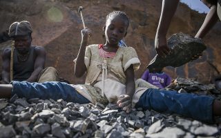 Irene Wanzila, 10, works breaking rocks with a hammer along with her younger brother, older sister and mother, who says she was left without a choice after she lost her cleaning job at a private school when coronavirus pandemic restrictions were imposed, at Kayole quarry in Nairobi, Kenya Tuesday, Sept. 29, 2020. The United Nations says the COVID-19 pandemic risks significantly reducing gains made in the fight against child labor, putting millions of children at risk of being forced into exploitative and hazardous jobs, and school closures could exacerbate the problem. (AP Photo/Brian Inganga)