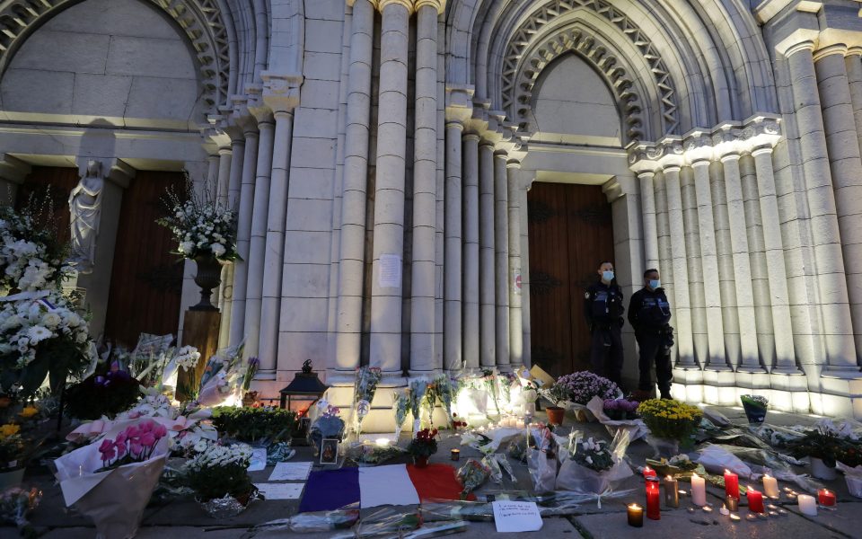 Candles, flowers and messages are seen in front of the Notre Dame church in tribute to the victims of a deadly knife attack in Nice, France, October 30, 2020. REUTERS/Eric Gaillard