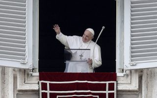 Pope Francis waves during the Regina Coeli noon prayer which he delivered from his studio window overlooking St. Peter's Square at the Vatican, Sunday, May 19, 2019. (AP Photo/Gregorio Borgia)