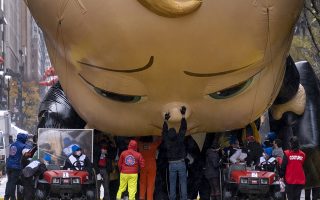 The Boss Baby balloon is deflated as it ends its appearance during the modified Macy's Thanksgiving Day Parade in New York, Thursday, Nov. 26, 2020. The annual parade goes on but only after great changes as compared to previous years due to the current deadly pandemic. (AP Photo/Craig Ruttle)
