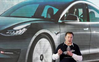 FILE PHOTO: FILE PHOTO: Tesla Inc CEO Elon Musk speaks onstage during a delivery event for Tesla China-made Model 3 cars at its factory in Shanghai, China January 7, 2020. REUTERS/Aly Song/File Photo/File Photo