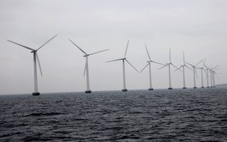 FILE PHOTO: Middelgrunden offshore wind farm is pictured outside Copenhagen, Denmark November 27, 2019. REUTERS/Andreas Mortensen/File Photo