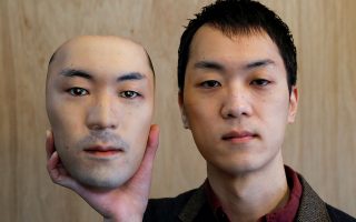 Shuhei Okawara, 30, owner of mask shop Kamenya Omote, holds a super-realistic face mask based on his real face, made by using 3D printing technology, in Tokyo, Japan December 16, 2020. REUTERS/Issei Kato     TPX IMAGES OF THE DAY
