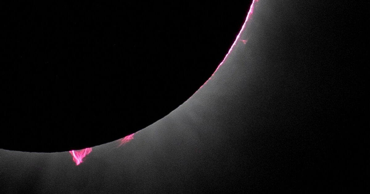 Total eclipse: What are those red dots around the sun?